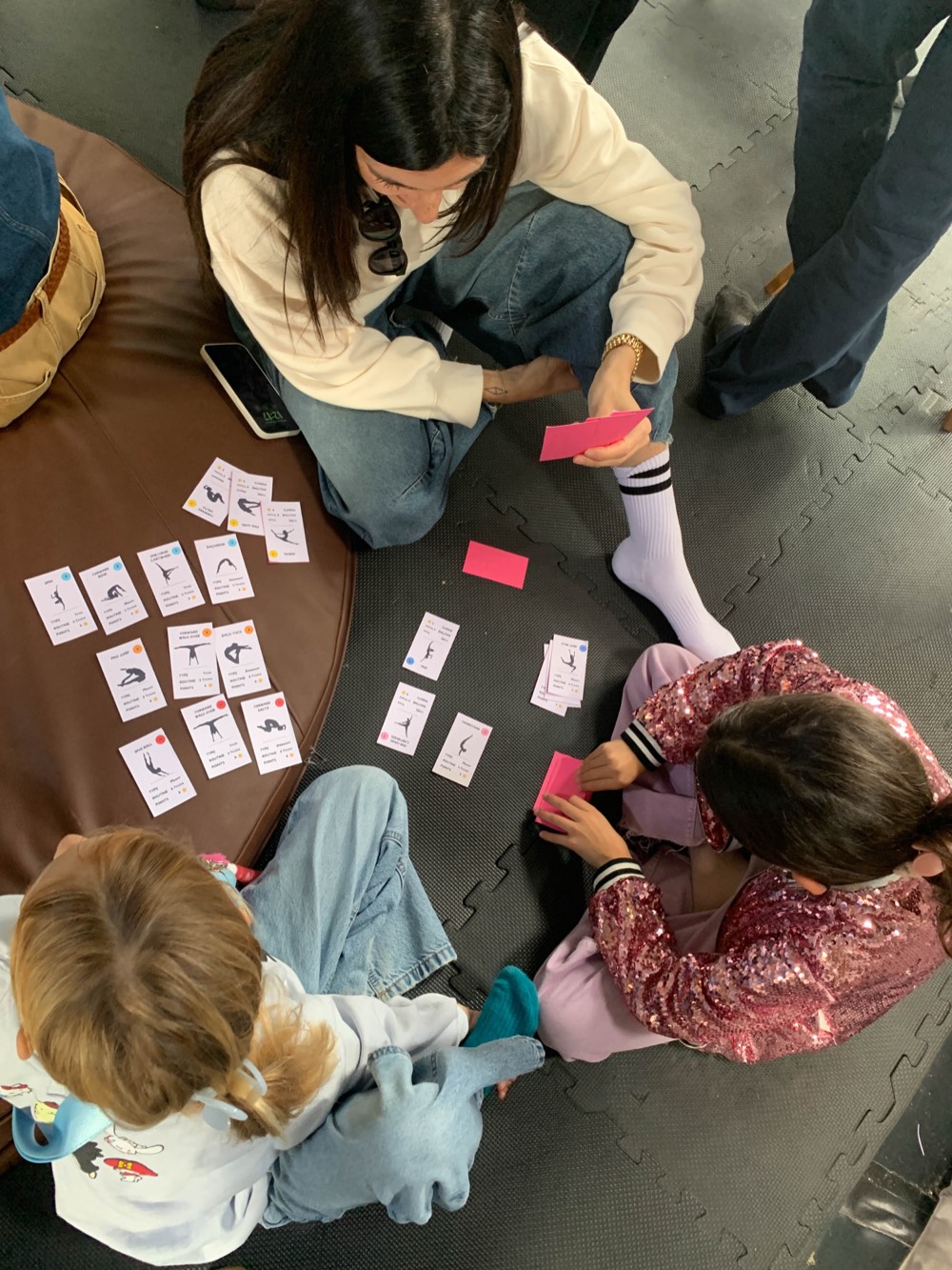 Children matching practice cards laid out on the floor, the Emotion-to-Tool Map in use